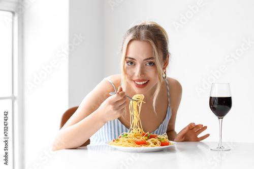 Young woman with glass of w...