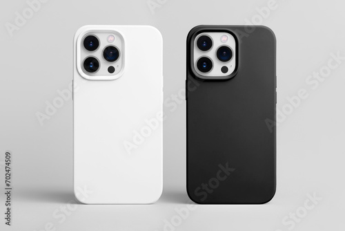 set of two smart phones in white and black cases back view isolated on gray background, iPhone 15 and 14 Pro max case mock up photo