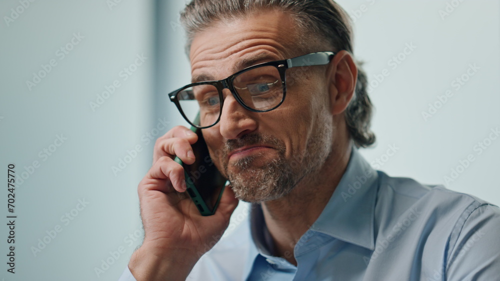 Smiling businessman speaking mobile phone closeup. Man talking cell emotionally Smiling businessman speaking mobile phone closeup. Man talking cell emotionally