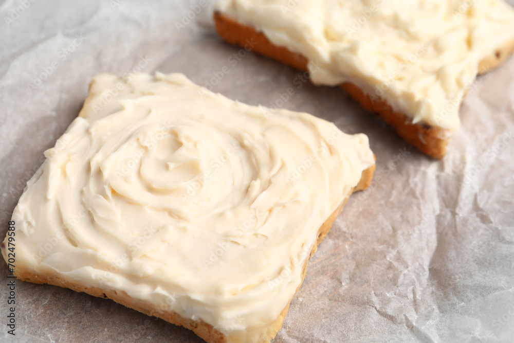 Tasty toasts with cream cheese on table