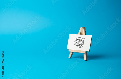 Фотография Easel sign with causeless doodles on a blue background