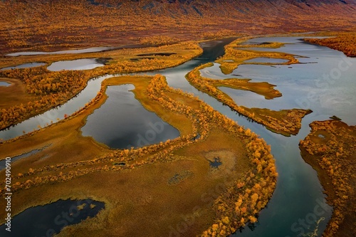 Drone image, view of the river Vistasjakka, meanders, lakes, birch trees by the water, bogs, extremely colourful, autumn mood, near Nikkaluokta, Norrbottens laen, northern Sweden, Sweden, Europe photo