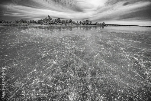 Ice cover with skate marks of the Duemmer, Lake Duemmer, east shore north of Lembruch, black and white, Lembruch, Diepholz county, Lower Saxony, Germany, Europe photo