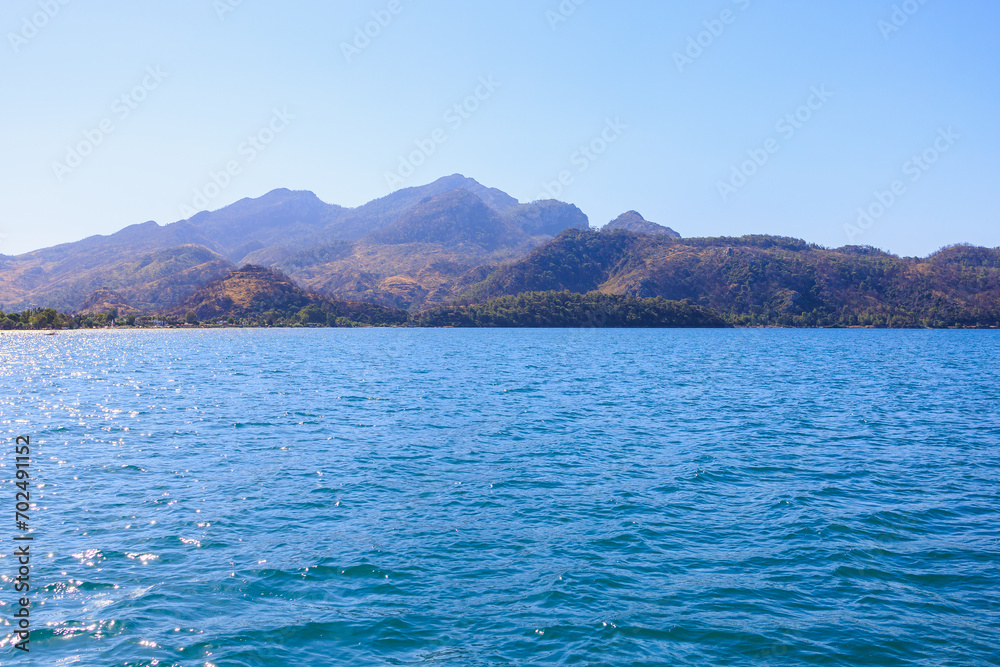 View of mountain landscapes from the sea. Background with selective focus and copy space View of mountain landscapes from the sea. Background with selective focus and copy space