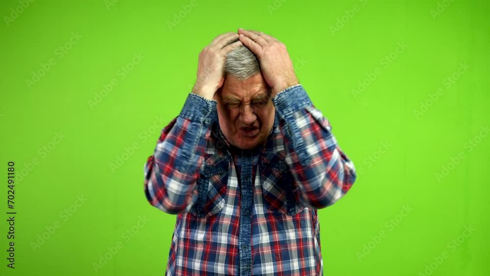 Senior man forgot to do something or lost opportunity and grabbing his head.