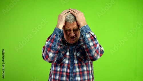 Senior man forgot to do something or lost opportunity and grabbing his head.