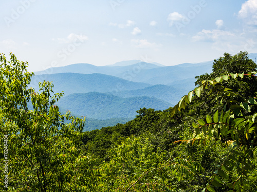 Fading mountains in the distance seen through the greenery in Shenandoah National Park, Virginia, USA