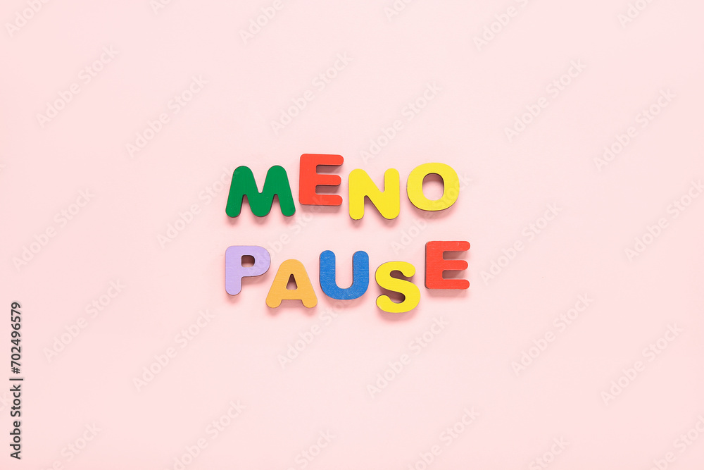 Word MENOPAUSE on pink background Word MENOPAUSE on pink background