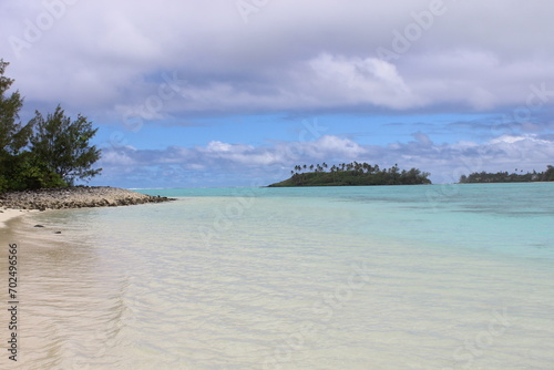 rarotonga clear water sky turquoise white beach cloudy sky