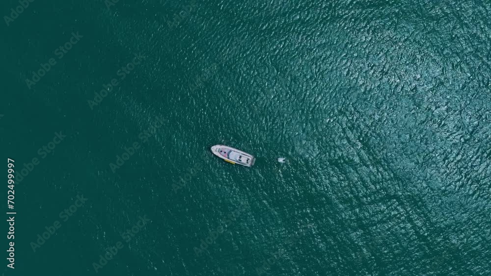 Aerial Top Lockdown Shot Of Nautical Vessel Moving In Wavy Sea On Sunny Day - Arugam Bay, Sri Lanka Aerial Top Lockdown Shot Of Nautical Vessel Moving In Wavy Sea On Sunny Day - Arugam Bay, Sri Lanka