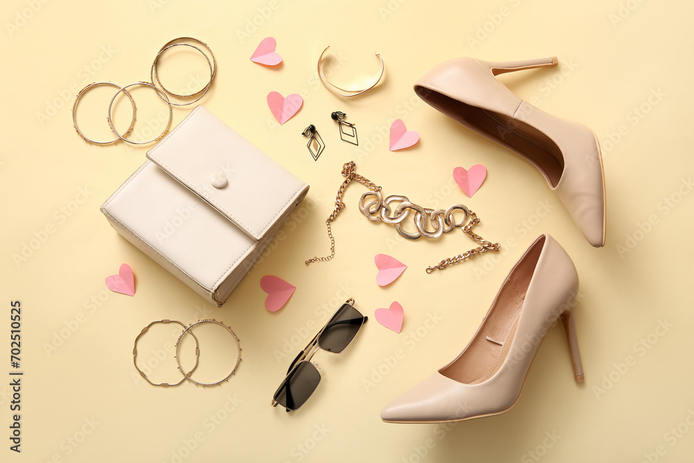 Composition with stylish high-heeled shoes, female accessories and paper hearts on color background. Valentine's Day celebration Composition with stylish high-heeled shoes, female accessories and paper hearts on color background. Valentine's Day celebration