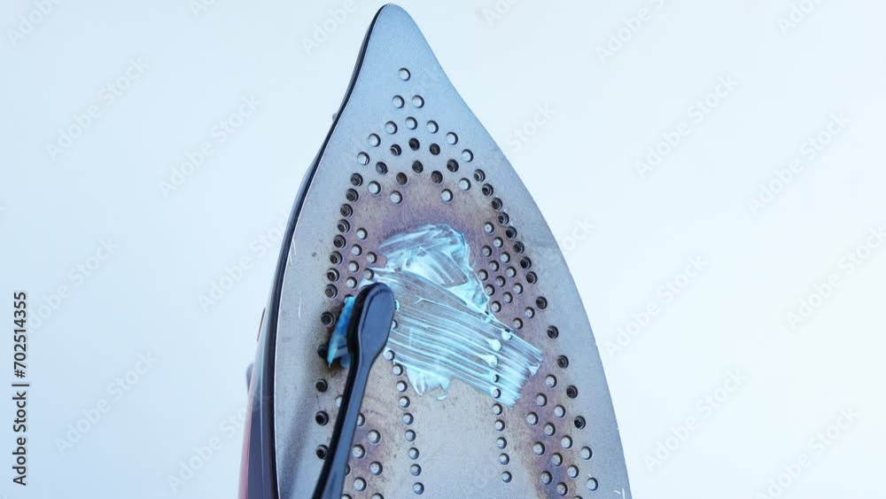 Burnt dirty electric flat iron. Clean an base surface with Toothpaste. burnt iron for ironing
