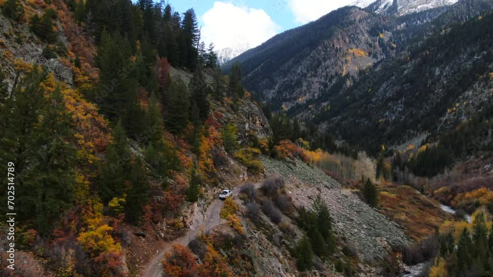 Cinematic drone aerial 4wd truck off road Marble Crystal Mill stunning autumn Aspen fall colors Southern Colorado Rocky Mountains peaks Ouray Telluride camping hiking river yellow trees follow forward Cinematic drone aerial 4wd truck off road Marble Crystal Mill stunning autumn Aspen fall colors Southern Colorado Rocky Mountains peaks Ouray Telluride camping hiking river yellow trees follow forward