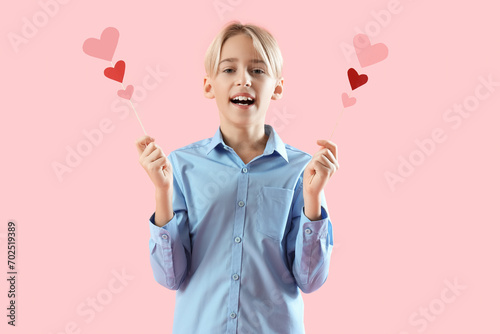 Happy little boy with paper...