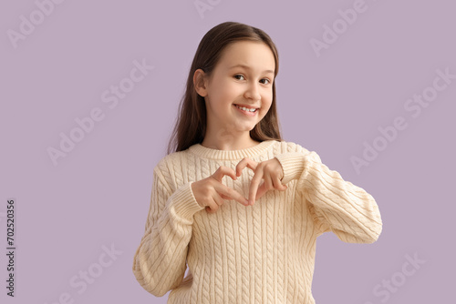 Cute little girl making hea...