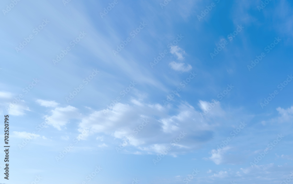 Blue sky with some clouds. View over the clouds light background. 