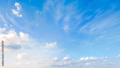 Blue sky with some clouds. View over the clouds light background.  photo