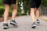 Healthy lifestyle. Couple running in park, closeup