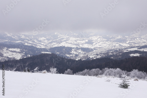 Picturesque mountain landscape with snowy hills on winter day