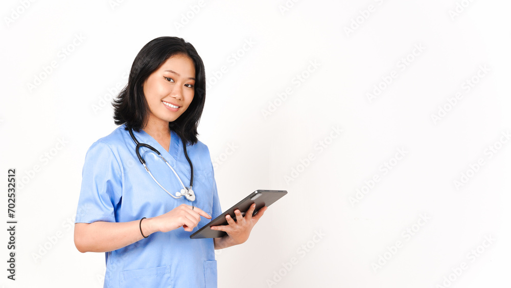 Young Asian female doctor using tablet for work and smiling isolated on white background Young Asian female doctor using tablet for work and smiling isolated on white background