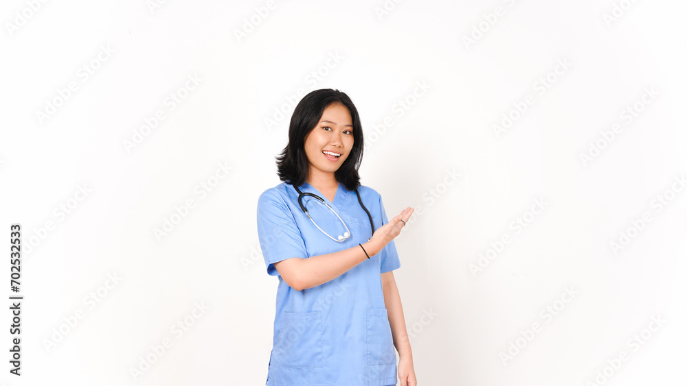 Young Asian female doctor showing copy space isolated on white background Young Asian female doctor showing copy space isolated on white background