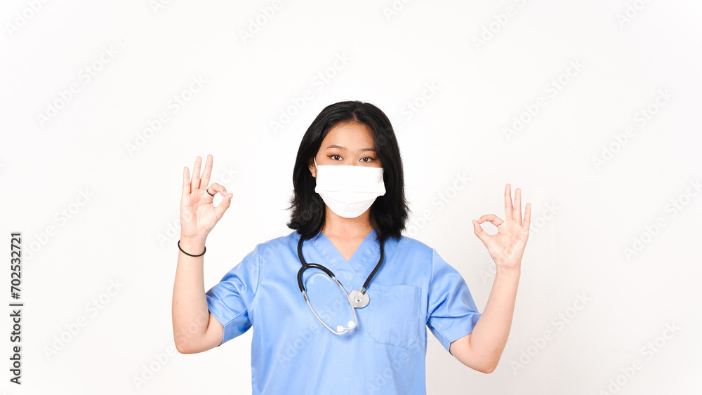 Young Asian female doctor showing okay sign isolated on white background Young Asian female doctor showing okay sign isolated on white background