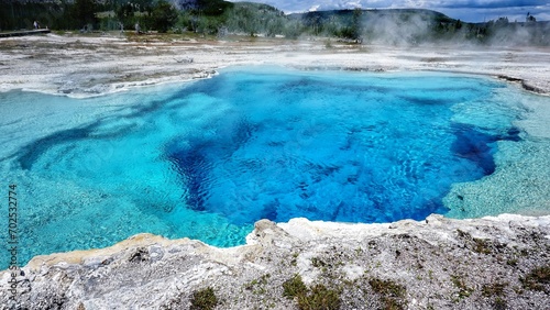 Colorful geysers hot springs in Yellowstone National Park, Wyoming Montana. Northwest. Yellowstone is a summer wonderland to watch the wildlife and natural landscape. Geothermal.   photo