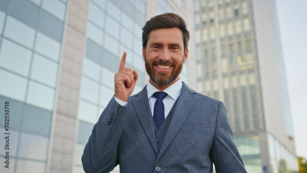 Smiling businessman finish call walking city street close up. Successful manager Smiling businessman finish call walking city street close up. Successful manager
