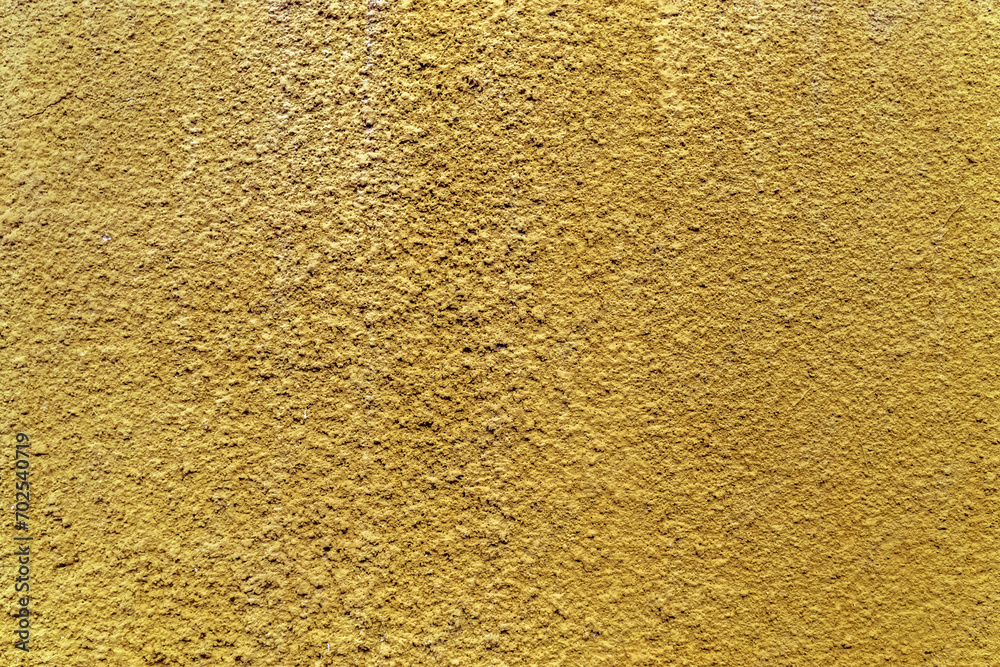 Crépi jaune doré sur mur Crépi jaune doré sur mur