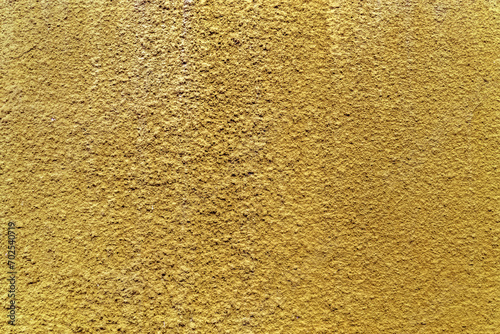 Crépi jaune doré sur mur