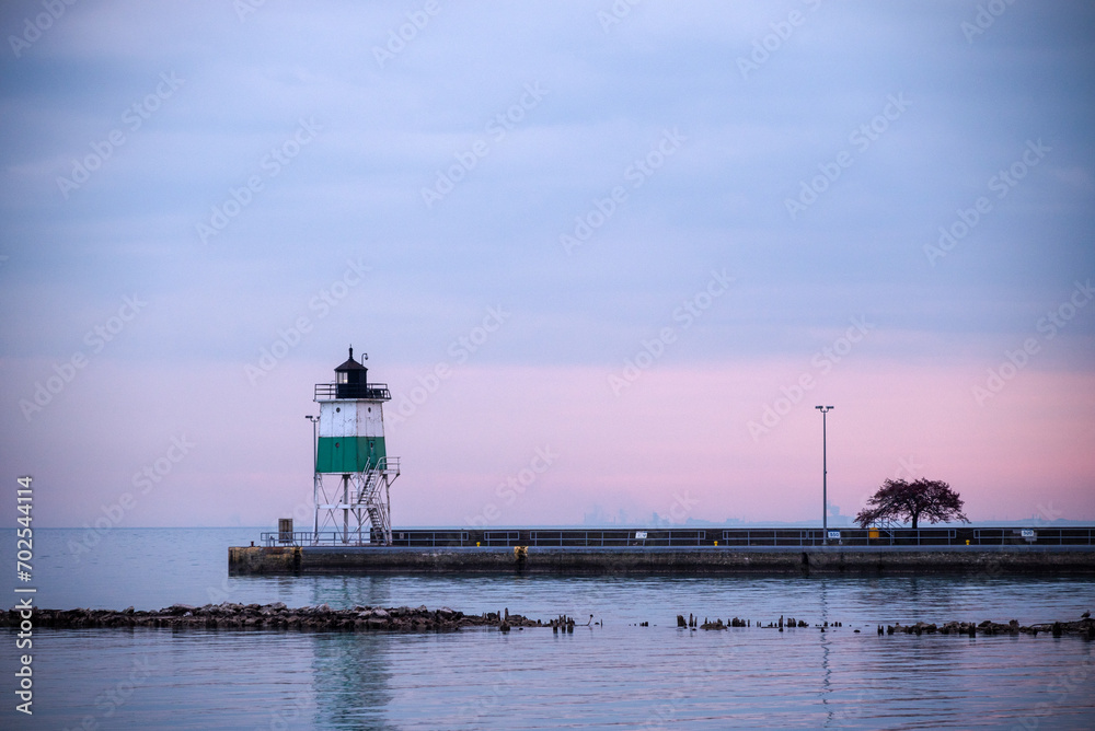 lighthouse on the pier at sundown
