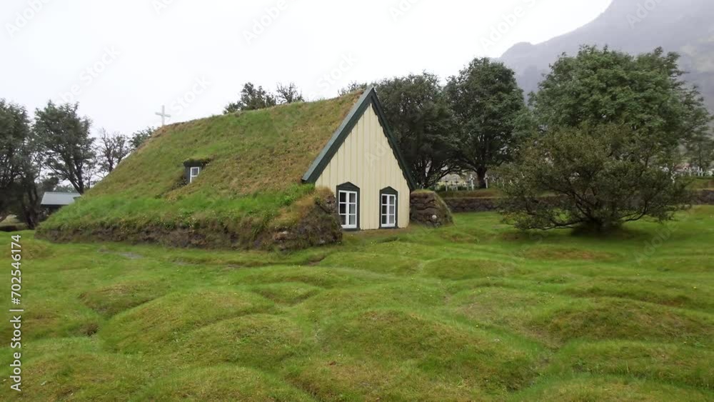 Famous Hofskirkja turf church in Öræfi, Iceland - Panning shot Famous Hofskirkja turf church in Öræfi, Iceland - Panning shot