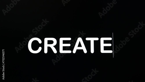 Using boldface and upper case letters to type the word create using a desktop computer. photo