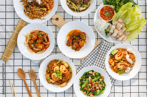 variety of Thai food Including menu Miang, crispy pork, steamed shrimp with vermicelli