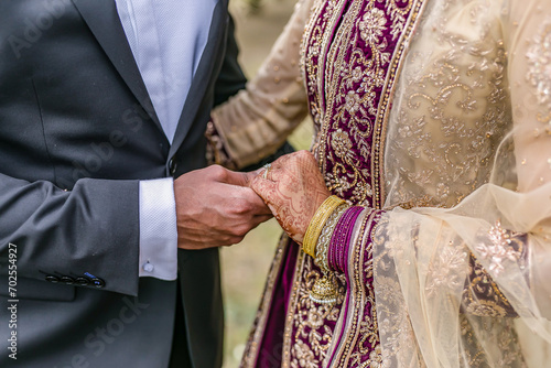 Indian couple's holding hands close up © Stella Kou