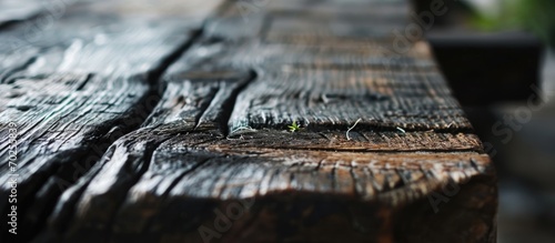Rustic table's textured dark wood.