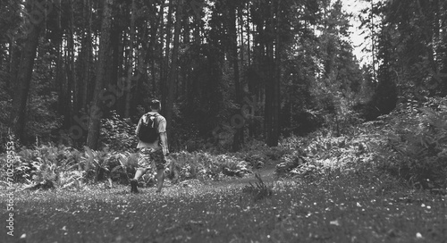 Hiking in the forest. Black and white toned image 