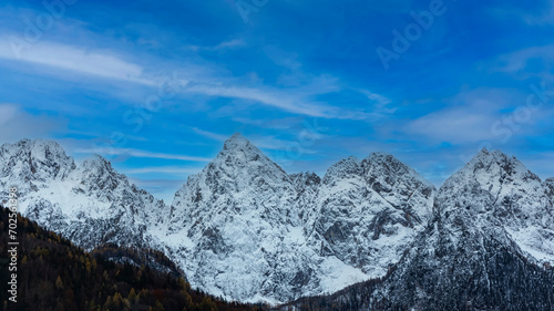 The banner mountain view of alpine as snow-capped mount peaks scene in Winter mountains background