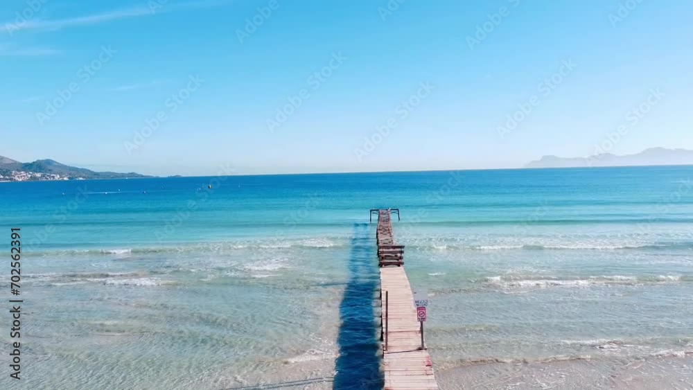 old pier on the playa de muro in mallorca