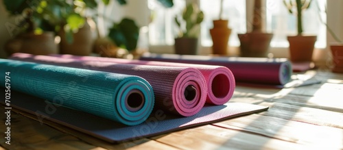 varied yoga mats placed on the table