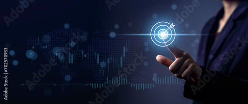 Business target strategy planning to success concept. Business development goal focus on leadership market. Holographic chart global economic trend analysis. Pointing arrow graph future growth plan.