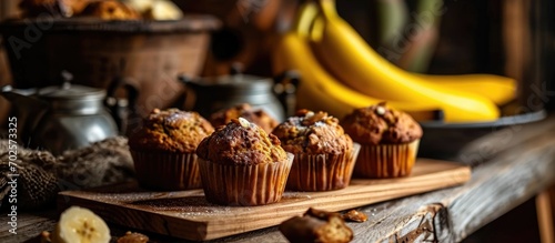 Bananas on a wooden board with muffins
