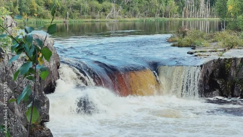 Voytsky padun waterfall in autumn. The famous powerful and wide Karelian waterfall Voytsky Padun is surrounded by rocks and greenery. Cascading waterfall on the river. Karelia, Russia 4K photo