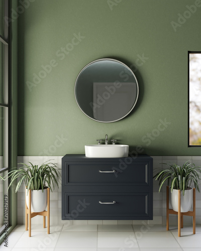 A modern furnished bathroom with a circle round mirror on a green wall and a modern vanity sink. photo