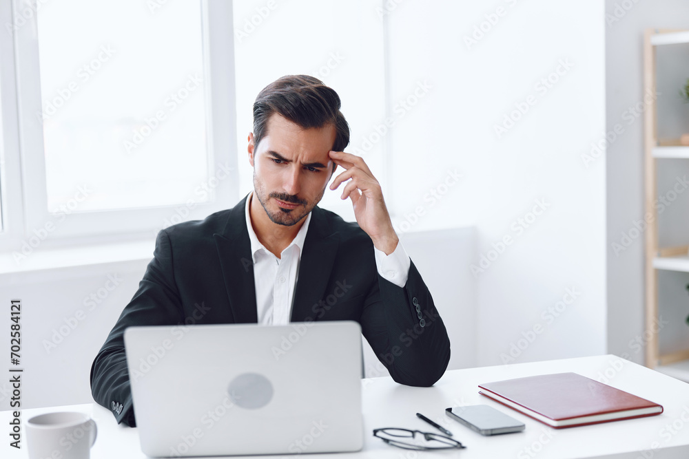 Man businessman tired computer sitting business laptop unhappy desk working office