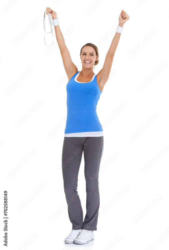Woman, workout success and celebration in studio with measure tape for exercise, fitness achievement or body goals. Model with fist and yes for results and training portrait on a white background