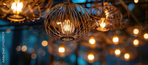 Modern wire ceiling lights with LED lamps, inspired by art nouveau style home design, display selective focus.