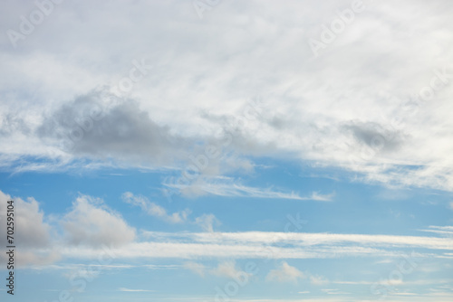 A beautiful sky tinted by the sun leaving vibrant shades of gold, pink, blue and multicolored. Clouds in the twilight evening and morning sky. Cloudy sky background in the evening and during the day. © Volodymyr