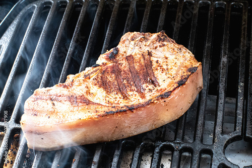 Pork Chop grilling on a barbeque
