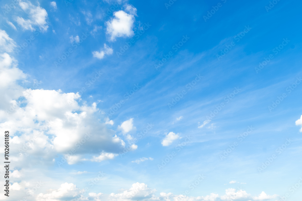 Blue sky with some clouds. View over the clouds light background Blue sky with some clouds. View over the clouds light background